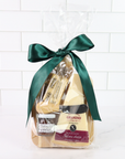 Packaged cheese with a green ribbon on a white tiled background