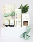 retirement gift box for her ith tea, blankets, nuts and tumbler