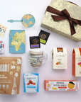 Collection of retirement gift basket items including a mug, snacks, and a decorative box on a white background